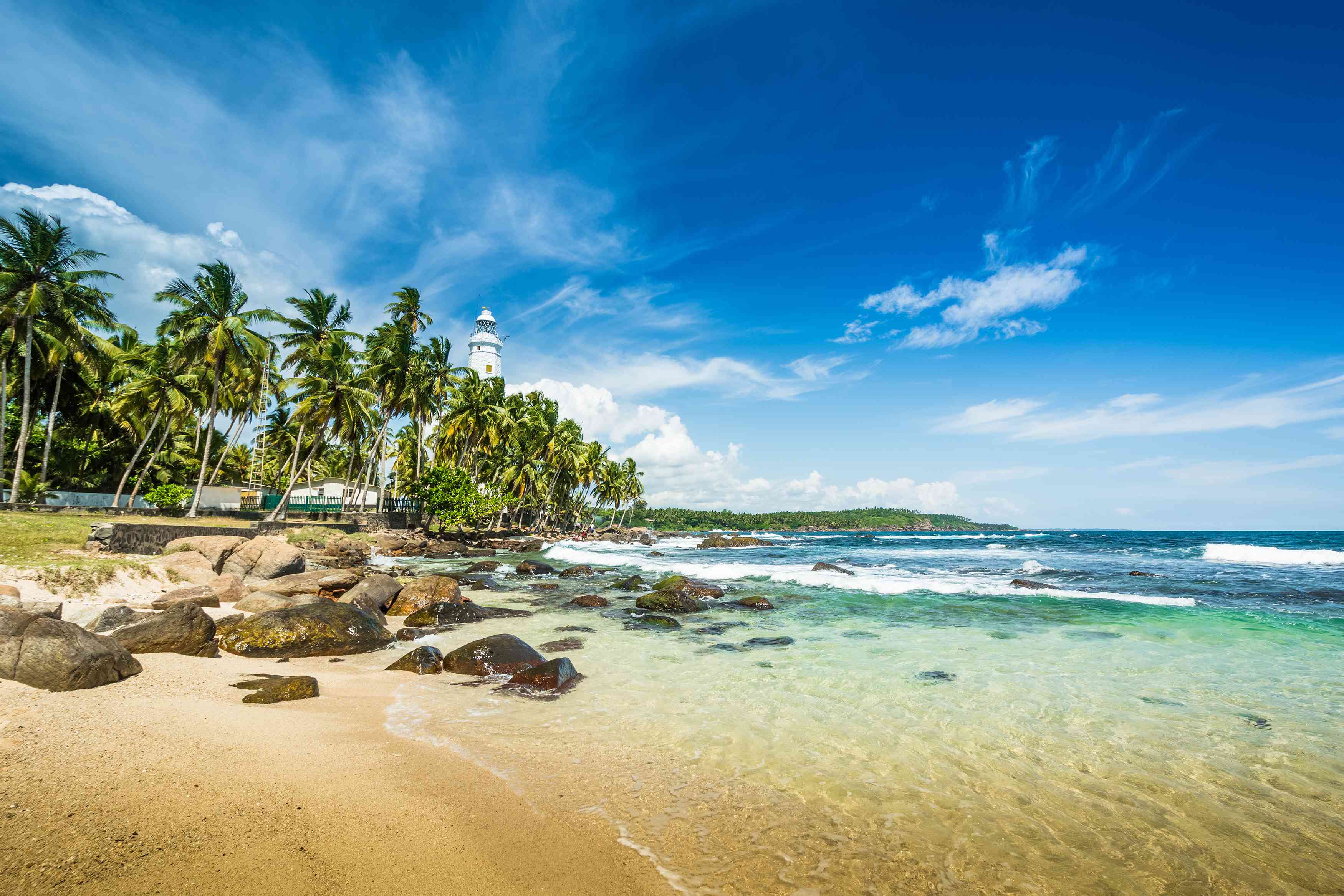 Golden beach and clear blue sea at Arugam Bay