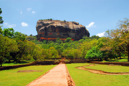 Ancient Sigiriya Rock Fortress rising above green forest